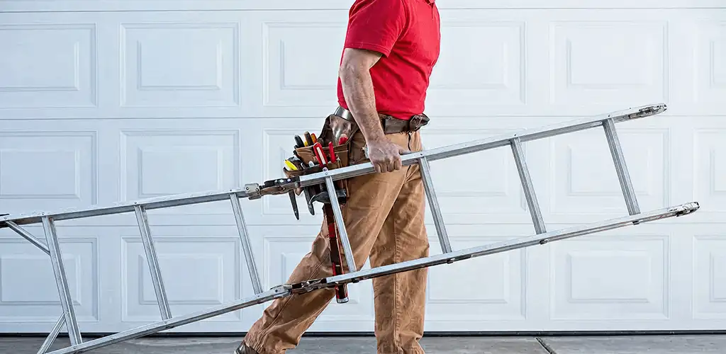 Garage door repair technician arriving with tools and ladder in Birmingham, AL