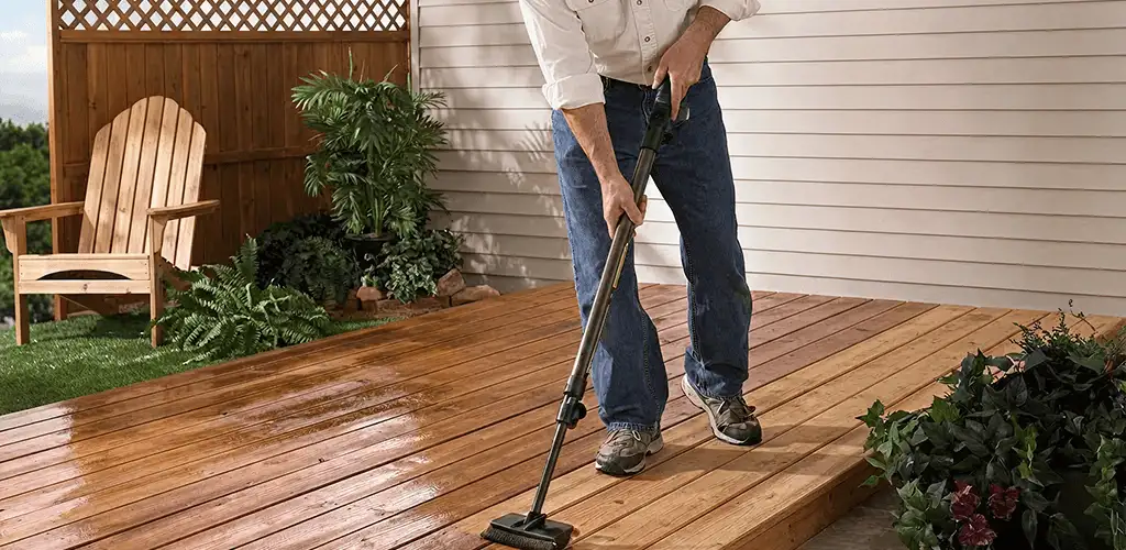 Deck staining service applying stain to a backyard wood deck in Birmingham, AL
